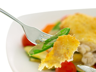 breaded fish fillet with vegetables