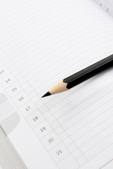 Naklejka premium Note book and pencil