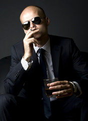 young businessman smoking a cigarette