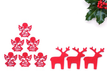 Christmas background with holly and reindeer