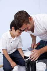Fototapeta premium Father and son preparing paint