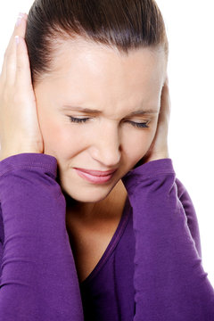 female with strong headache squeeze head