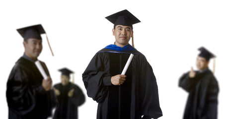 Graduate in front of Blurry Graduates - 17957555