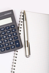 Pen on notebook, isolated on white background.