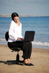 Business woman at the beach