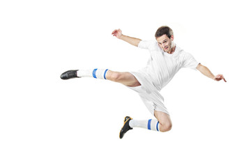 Soccer player in a jump isolated on white background