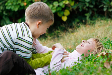 happy children playing in grass