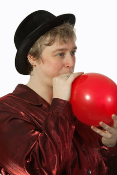 Woman Blowing Up Balloon