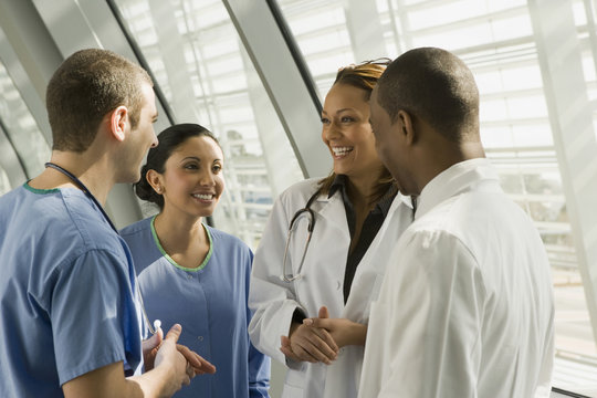 Multi-ethnic doctors and nurses talking