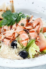 salad with grilled salmon fillet.
