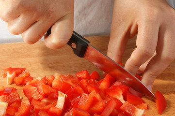 cut one organic paprika, two hands and a knife