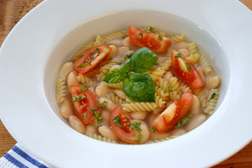 mediterranean noodle soup with white beans and tomato