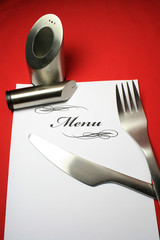 Menu with salt and pepper shaker fork and knife