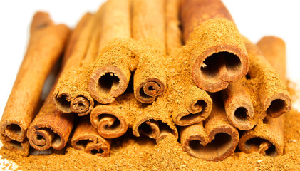 Cinnamon bark and powder isolated on white