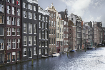 Fototapeta na wymiar Amsterdam canals and typical houses on a blue sunny day
