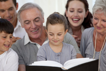 Obraz premium Close-up of family looking at a photograph album