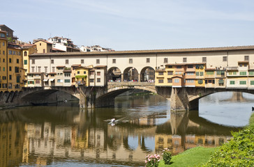 Fototapeta na wymiar Kayak Rowing Under Ponte Vecchio