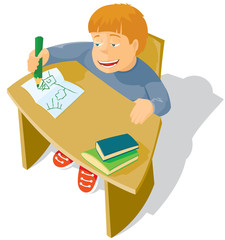 The schoolboy sits at a school desk