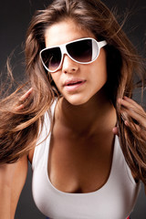 Fototapeta premium closeup of Glamour woman with sunglasses on black background