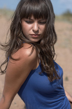 The sexual girl in a dark blue dress
