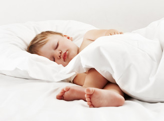 Fototapeta na wymiar Baby lying on white sheet