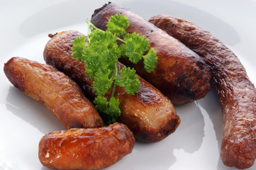 choise of different sausages on a white plate