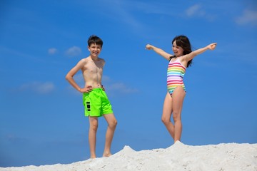 Kids in bathing suits on beach
