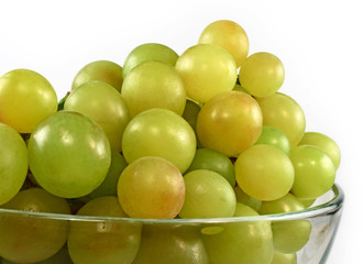 Green grapes in glass bowl isolated