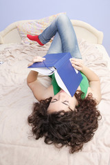 teenage girl reading a book