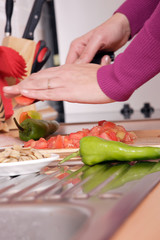 woman cooks dinner in her kitchen