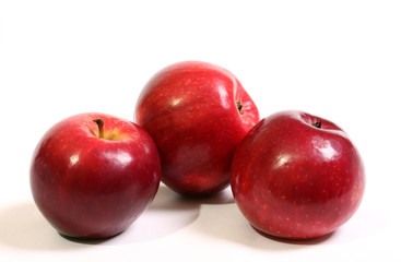 Juicy, ripe, red apples on a white background.