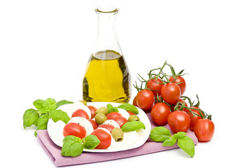 caprese - Italian salad with cherry tomatos, olives and mozarell