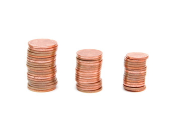 towers of golden coins isolated on white
