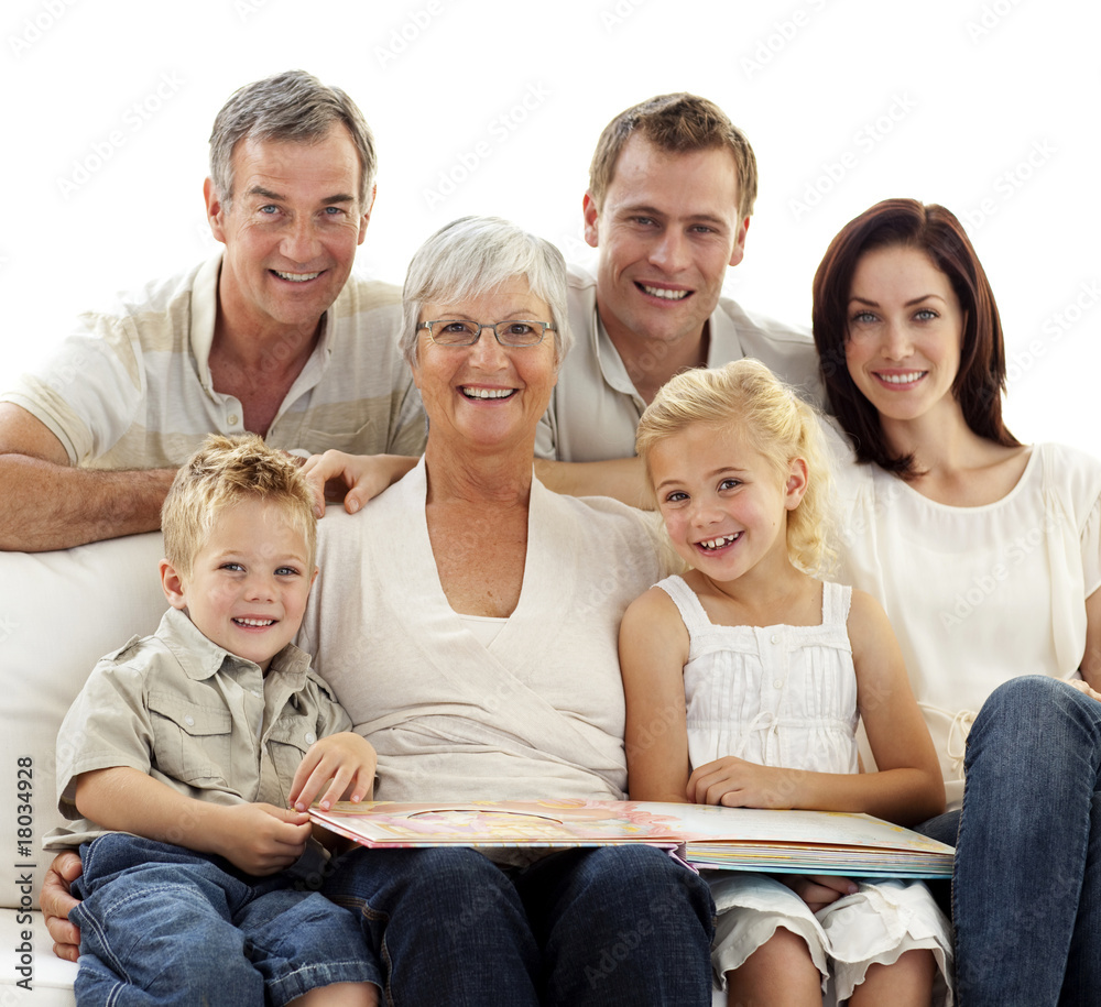 Wall mural Smiling family observing photograph album