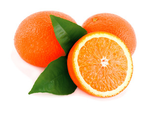 Ripe oranges with green leaves