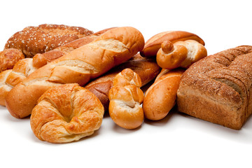 Assorted kinds of breads on a white background