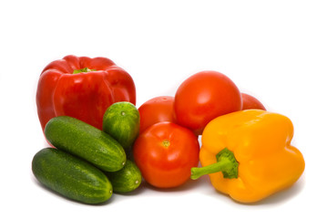 Fresh tomatoes, cucumbers and pepper on a studio white backgroun