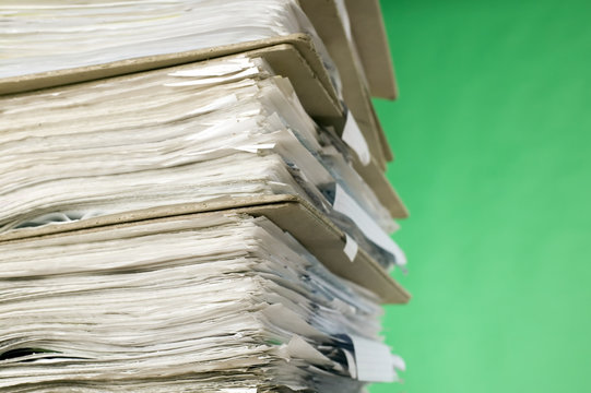Finance documents on green background