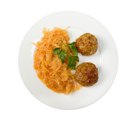 chops withstewed cabbage on plate