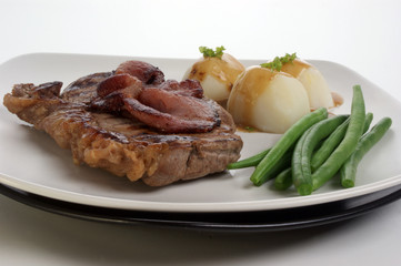 grilled rump steak and bacon with organic vegetable