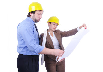 Young attractive engineers with blueprints