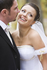 laughing beautiful bride close to her groom