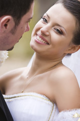 happy bride looking at her groom