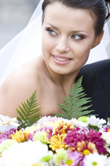 charming bride holding flowers