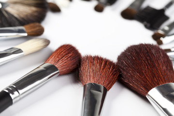 Set of cosmetic brushes on white background