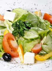 Caesar salad in a white plate.