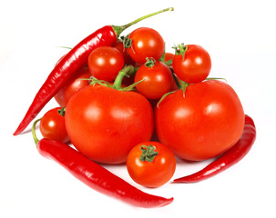 Tomatoes and peppers isolated on white