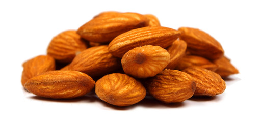 Heap of almonds isolated on white