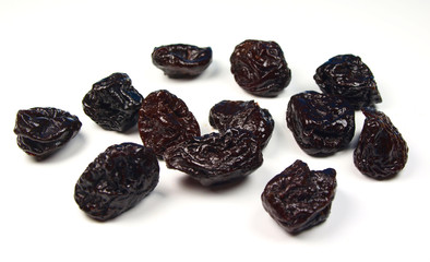 Dried plums isolated on white