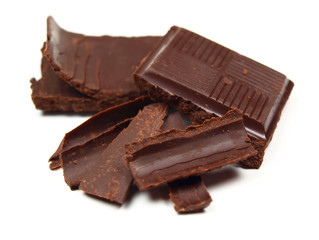 Chocolate pieces and slices isolated on white